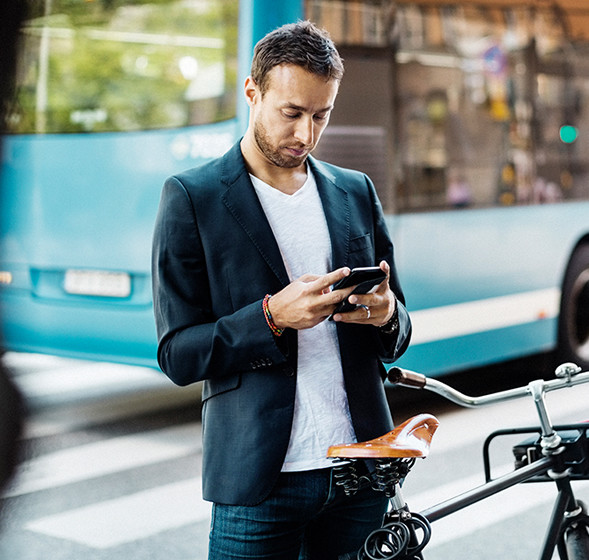 Man reading accounting figures on mobile